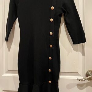 Elegant Black Dress with Gold Button Accents